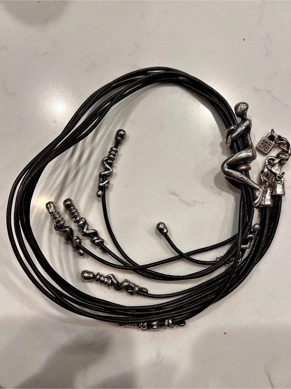 Uno de 50 Silver Plated Figural Human Multi Strand Leather Necklace